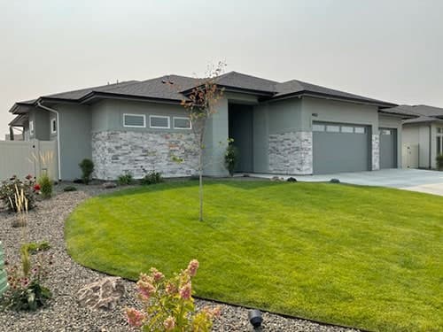Freshly planted garden bed with new landscaping