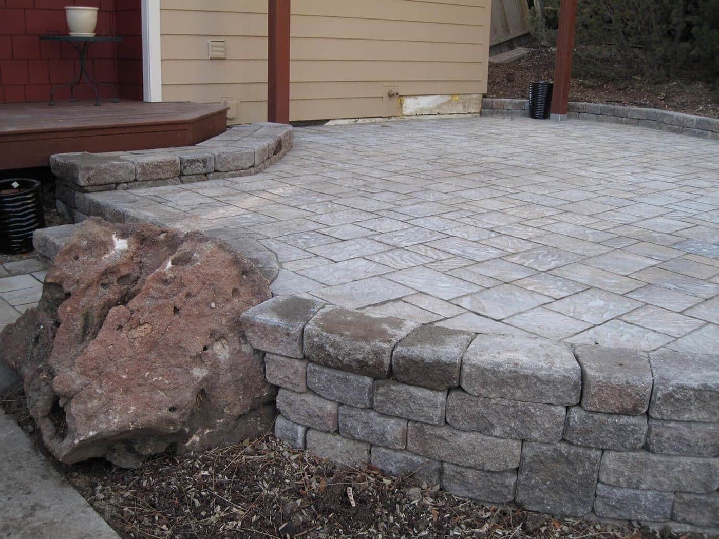 Completed landscape design with patio, plantings and lawn